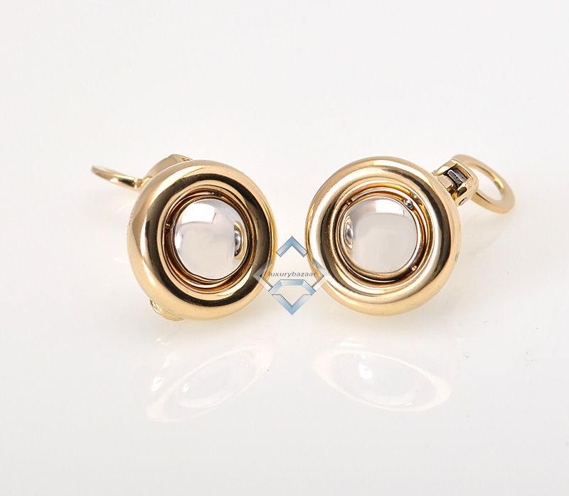   earrings   round circles of yellow gold hold a solid ball, half of